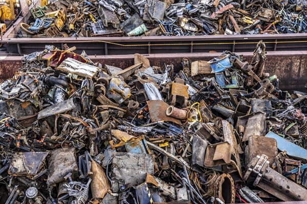 Push barge, loaded with scrap metal, for recycling, melting down, in the harbour canal,