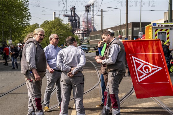 Steelworkers at a demonstration in front of the headquarters of ThyssenKrupp Steel Europe in
