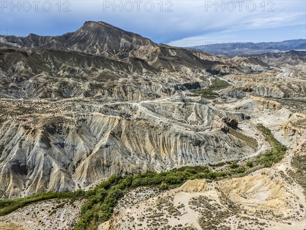 Barren mountain slopes and valleys with rugged, dry landscape, aerial view, Tabernas Desert,