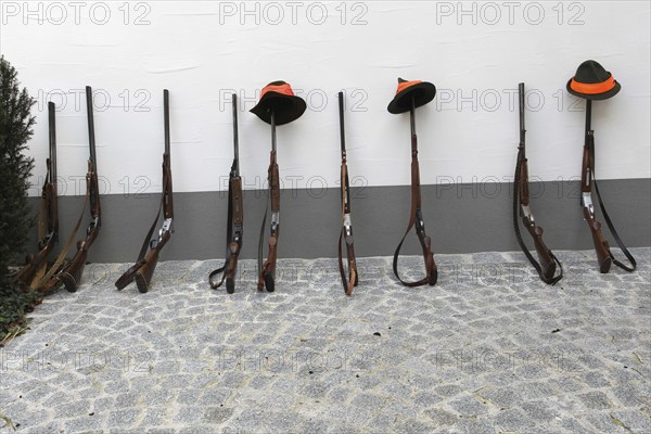 Hunting rifles, so-called shotguns, leaning against a house wall, Lower Austria, Austria, Europe
