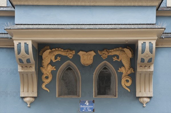 Detailed view of a bay window with dragon figures from a town house from 1899, Regensburg, Upper