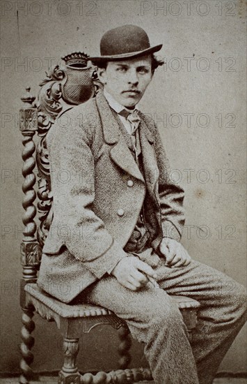 Photo of a man in a suit and bowler hat, sitting on a chair, Carte de Visite, 1890, Historical,