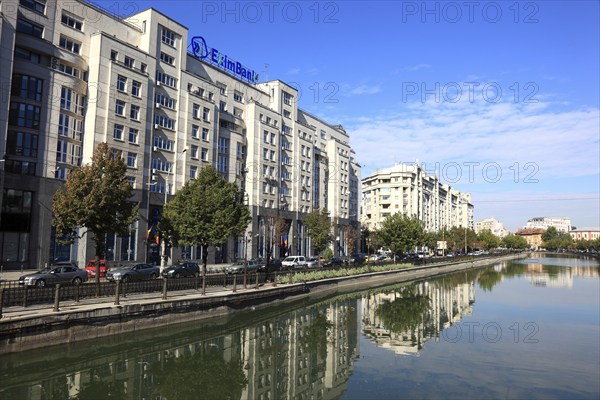 Apartment blocks and office buildings, bank building on the Dambovita River, Bucharest, Romania,