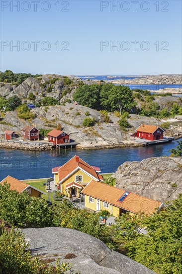 View of summer house by a rocky coast in the archipelago on the Swedish west coast on a sunny