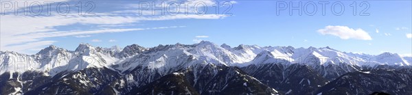 Alpine panorama with snow-covered mountain peaks in winter. Taken in the ski resort of Serfaus Fiss