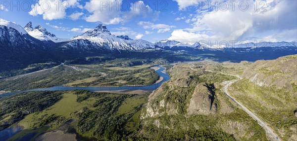 Confluence of river Estero Parada flowing into Rio Ibanez, aerial view, snow-capped mountains in