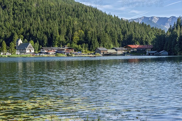 Mountain lake and village Spitzingsee, municipality Schliersee, behind mountains Krenspitze and