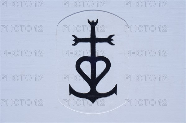 Picture with the cross of the Camargue, in front of a white background, bullfighting arena,
