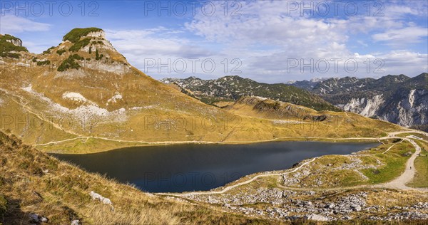 Panorama. Lake Augstsee and the Atterkogel mountain on the Loser. View of other mountains. Autumn,
