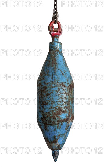 Big plummet, plumb bob level with chain used for digging mine shaft in coal mining, close-up on