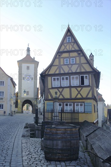 Siebersturm as part of the historic town fortifications and yellow half-timbered house, town gate,
