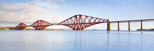 View of the red railway bridge Forth Bridge at the Fírth of Forth estuary near South Queensferry,