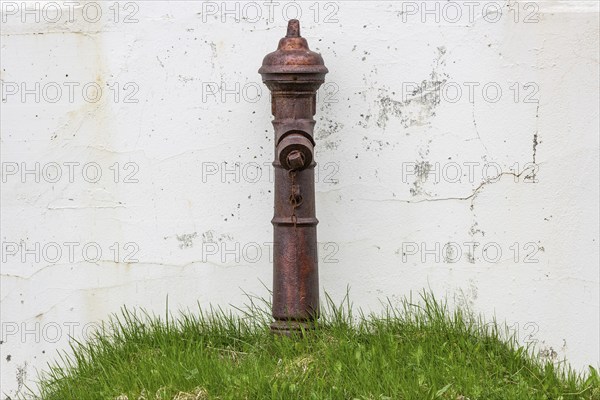 Hydrant on grassy hill, Djúpavík, Reykjarfjörður, Strandir, Árnes, Westfjords, Iceland, Europe