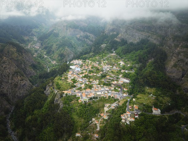 Aerial drone view of Curral das Freiras village in Valley of the Nuns from Miradouro da Eira do