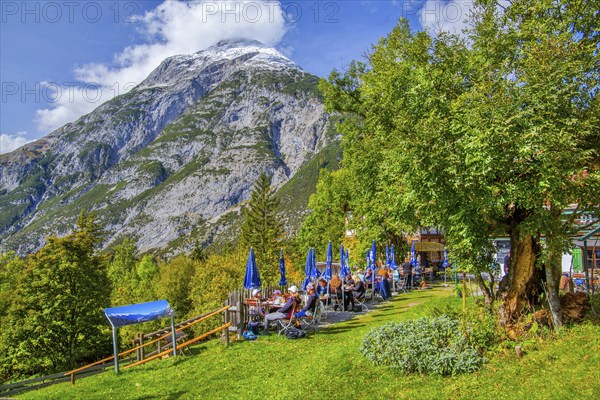 Restaurant terrace of the Landgasthof Ropferstubn above the Inn Valley in front of the Hohe Munde
