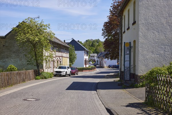 Street with residential buildings through the Schönau district, Bad Münstereifel, Eifel, Euskirchen