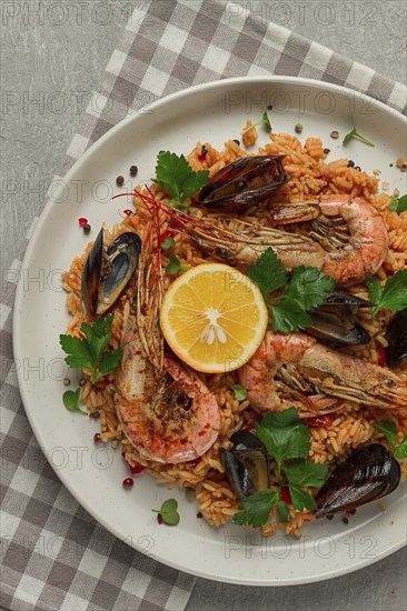 Seafood paella, shrimp and mussels risotto, rice, homemade, top view, no people