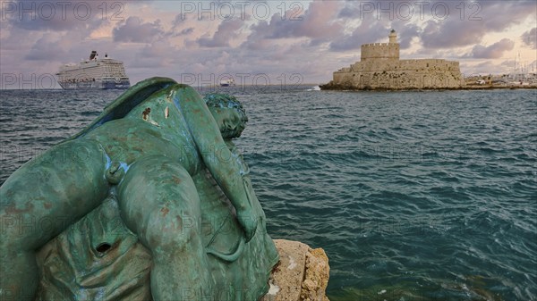 A damaged sculpture looks out over the sea and a fortress during a dramatic sunset, sky exchanged,