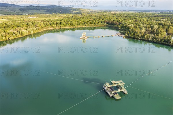 Aerial view of turquoise quarry pond of a gravel pit, Burkheim, Rhine valley, Germany, Europe