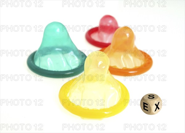 Coloured condoms and cubes with the inscription: SEX, Studio