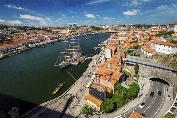 Aerial view of Porto city and Vila Nova de Gaia and Douro river with moored sailling ship from Dom