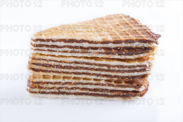 Waffle sandwiches with boiled condensed milk isolated on white background. closeup