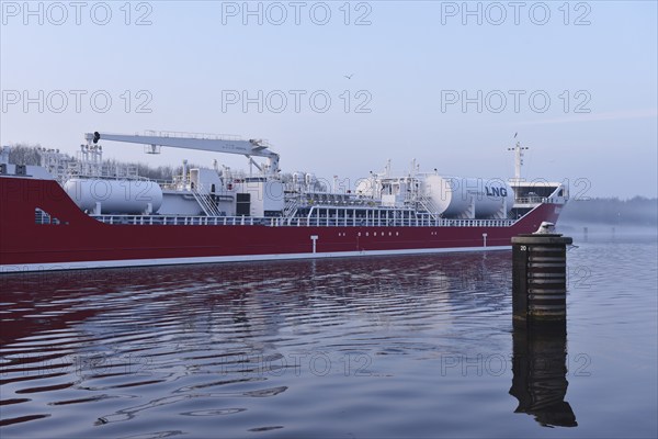 LNG tanker Ramanda sailing in fog in the Kiel Canal, Kiel Canal, Schleswig-Holstein, Germany,