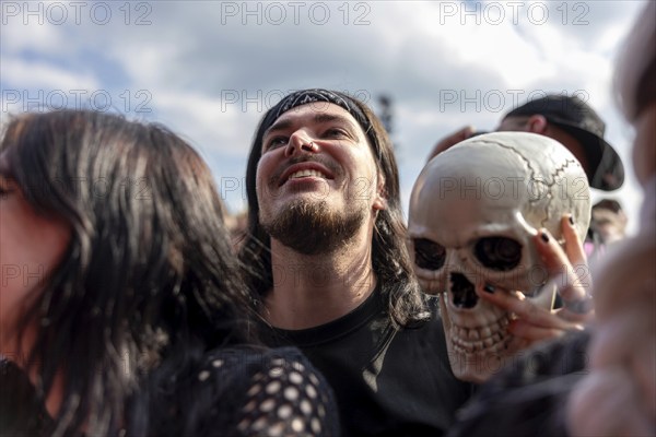 Adenau, Germany, 7 June 2024: Fan with skull at Rock am Ring. The festival takes place at the