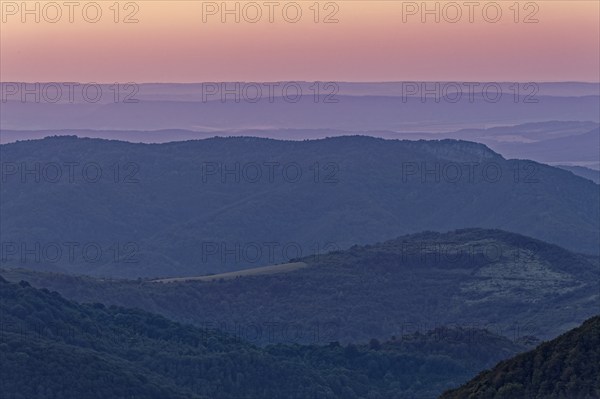 Dawn over the mountain landscape of the Balkan Mountains and the wooded slopes of the Balgarka