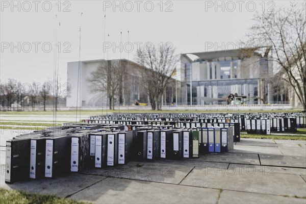 File folders stand in front of the Federal Chancellery as part of a protest action by the German