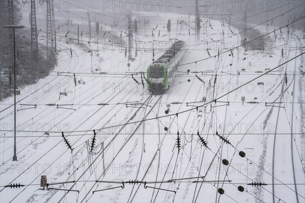 Onset of winter with lots of fresh snow and temperatures below -5 degrees during the day, railway