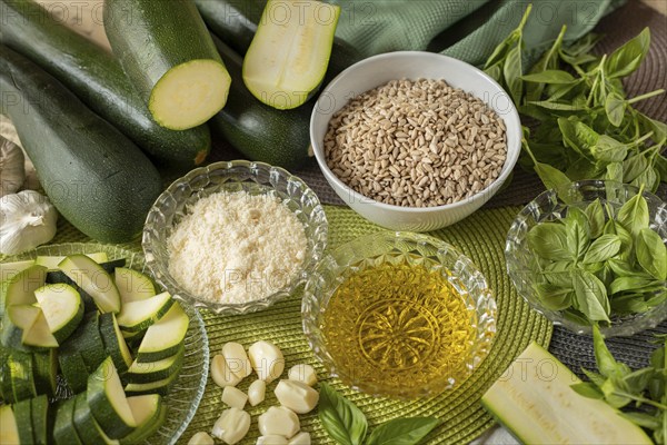 Pesto ingredients, courgette, sunflower seeds, cheese, olive oil, garlic and basil