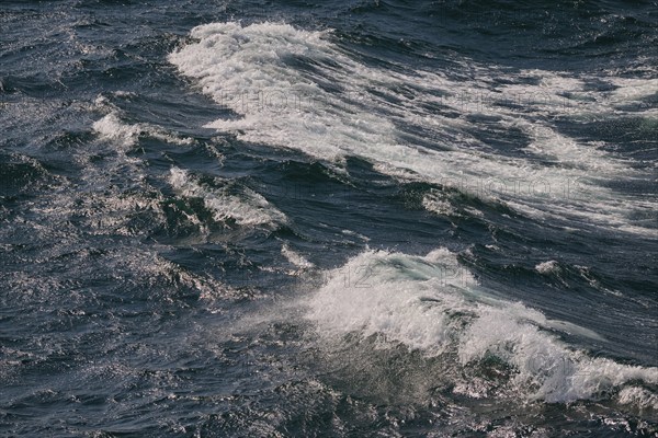 Dynamic sea waves with foaming water in different shades of blue, North Sea, Denmark, Europe