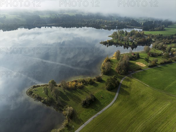 Sports facility and bathing area, lake Rottachsee, shore covered with fog, autumn, aerial view,