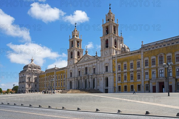 Large square in front of a baroque palace with magnificent architecture under a clear sky, National