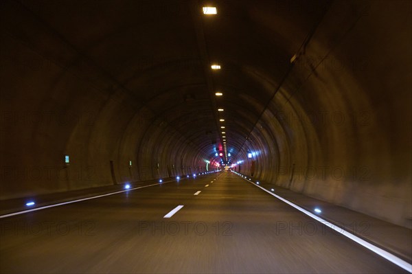 Motorway tunnel A71 with illuminated road and modern light installations offering a perspective