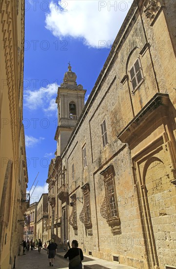 Historic buildings and Carmelite church and priory inside the medieval city of Mdina, Malta, Europe