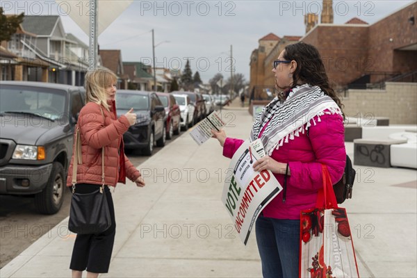 Hamtramck, Michigan USA, 27 February 2024, Lindsey Matson urges people arriving to vote in