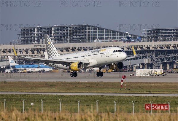 Stuttgart Airport with terminal, aircraft of the airline Vueling landing. Stuttgart,