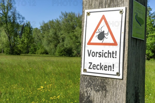 Warning signs for ticks, in the Urdenbachen Kämpe nature reserve, Lower Rhine cultural landscape
