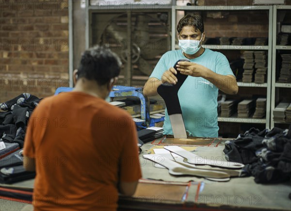 Employees of Inter Market Knit Private Limited producing socks. Lahore, 22.08.2024. Photographed on