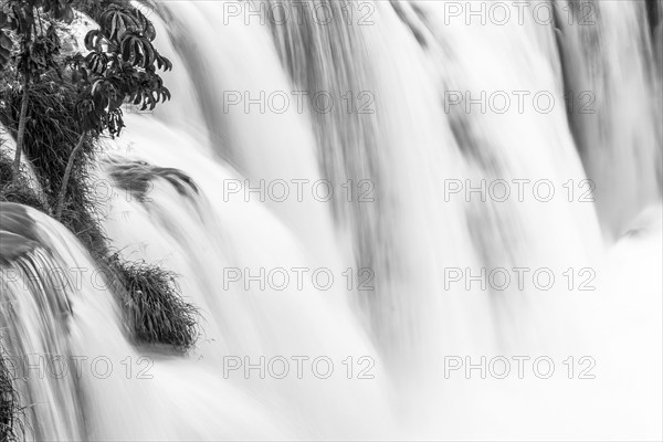B&W landscape photo of falling water over the edge of the water fall. Long exposure image of