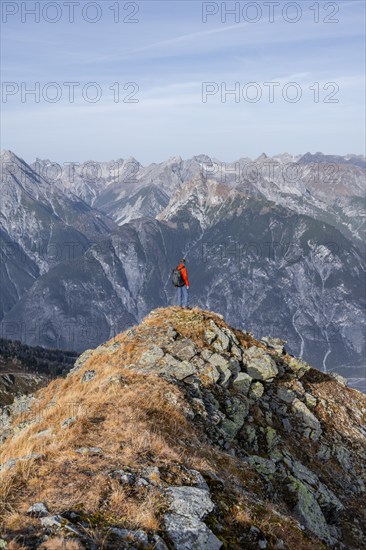 Mountaineers in front of a mountain panorama, view from the ridge of the Venet to mountains of the