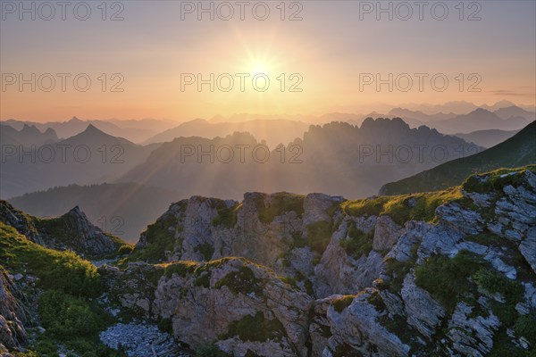 Fribourg Prealps with Gastlosen mountain range at sunrise, Bernese Alps behind, cantons of Fribourg