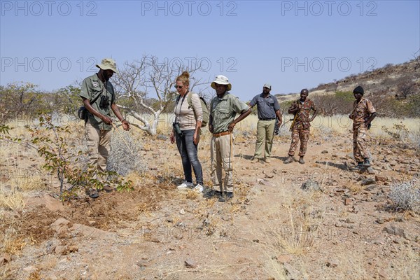Tourist group on a rhino tracking trip, Huab Conservancy, near Khorixas, Kunene Region, Namibia,