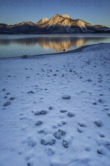 Sunrise over mountain lake, reflection, winter, Walchensee, view of Herzogstand and Heimgarten,
