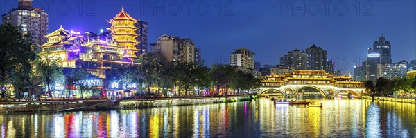 Chengdu Anshun Bridge over Jin River with pagoda panorama at night in Chengdu, China, Asia