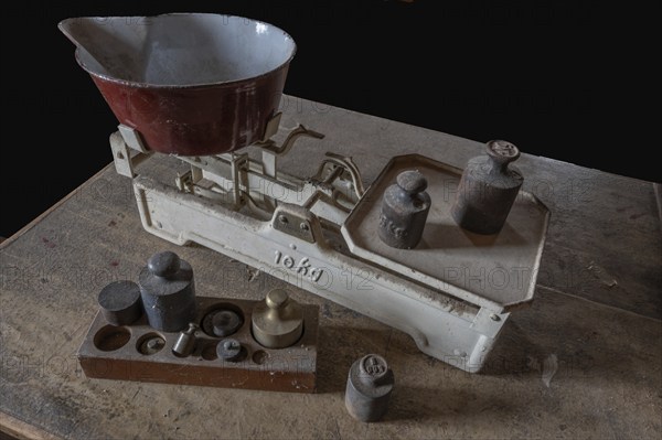 Old scales with weights in a former corn mill, Bavaria, Germany, Europe
