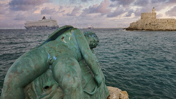 A damaged sculpture looks out over the sea and a fortress during a dramatic sunset, sky exchanged,