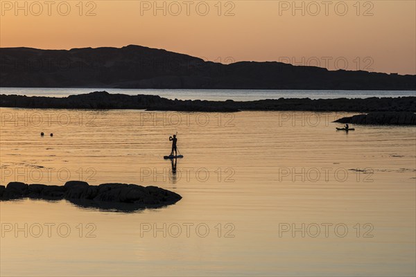 Stand up paddling, Sup, sunset, coast at Fidden, Isle of Mull, Scotland, United Kingdom, Europe